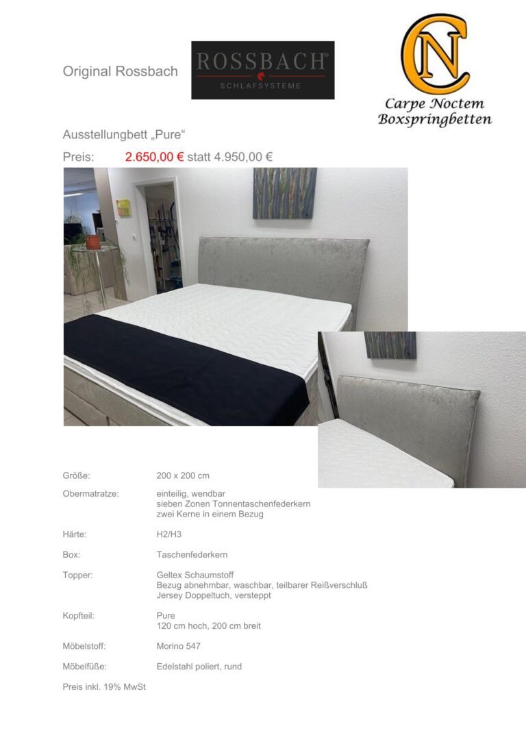 Eine Ausstellungsmatratze mit dunklem Kopfteil einer anonymen Person lächelnd daneben